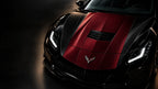 Bordeaux satin car wrap on the hood of a black sports car