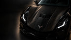 Bronze contour car wrap on the hood of a black sports car