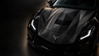 Shadow geometry car wrap on the hood of a black sports car