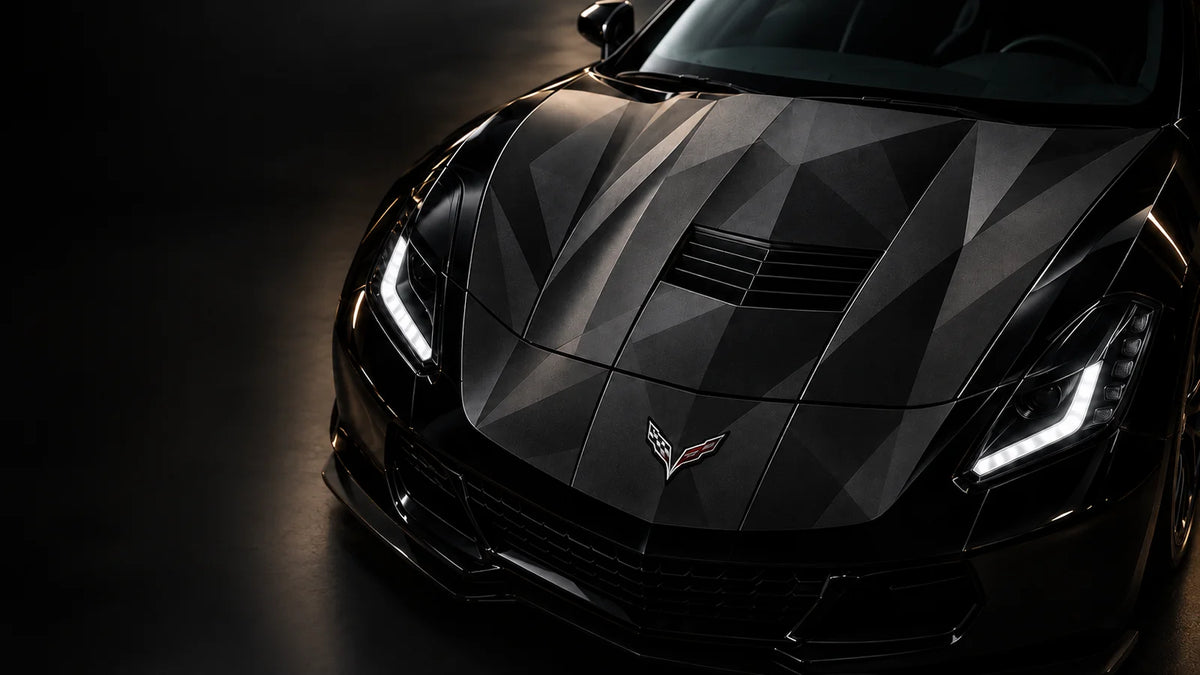 Shadow geometry car wrap on the hood of a black sports car