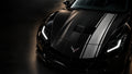 Silver apex car wrap on the hood of a black sports car