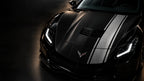 Silver apex car wrap on the hood of a black sports car