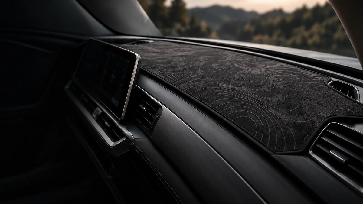 Graphite contour dashboard mat fitted in a car's cabin