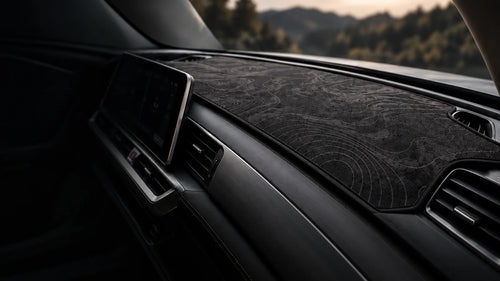Graphite contour dashboard mat fitted in a car's cabin