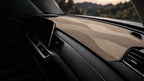 Taupe wave dashboard mat fitted in a car's cabin